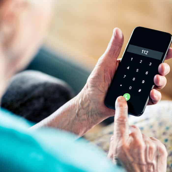 112, emergency phone call number. Old senior woman. First aid, medical help or fire alarm. SOS hotline support center. Ambulance, paramedic or police. Elder person and mobile. Injury, pain or accident